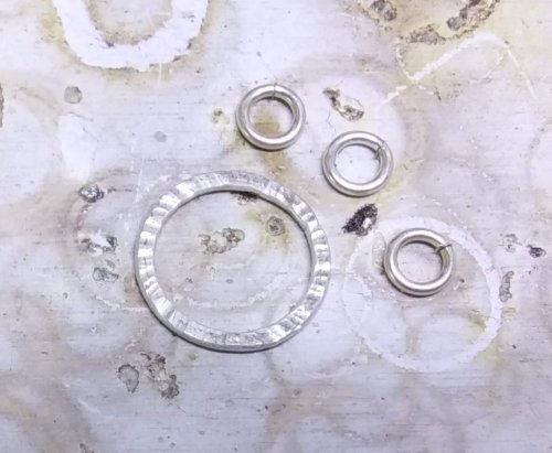 Judy Larson's Bracelet Links 1, 2,3 - , Findings & Components, Toggles & Clasps, Earwire & Headpin, Butane Torch, Soldering, Solder, Ball one 3/8 piece of 18 gauge wire on a magnesia solder brick for each link.
